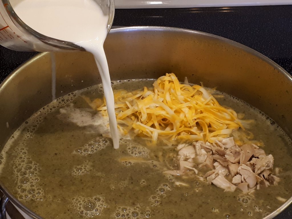 Patricia Fentie Adding Cream, cheese and chicken to soup mixture image