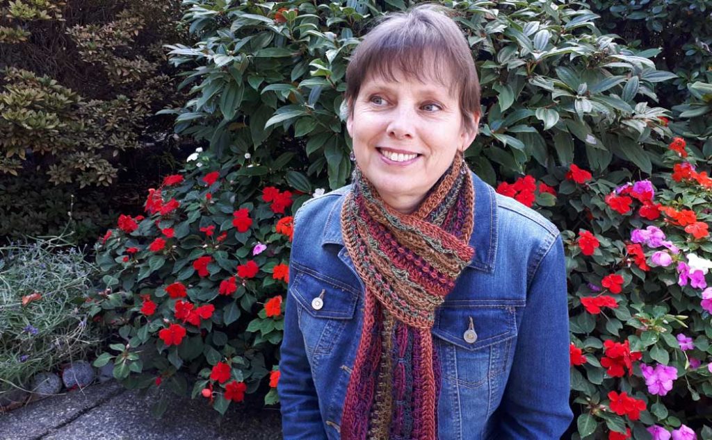 Woman wearing crochet scarf