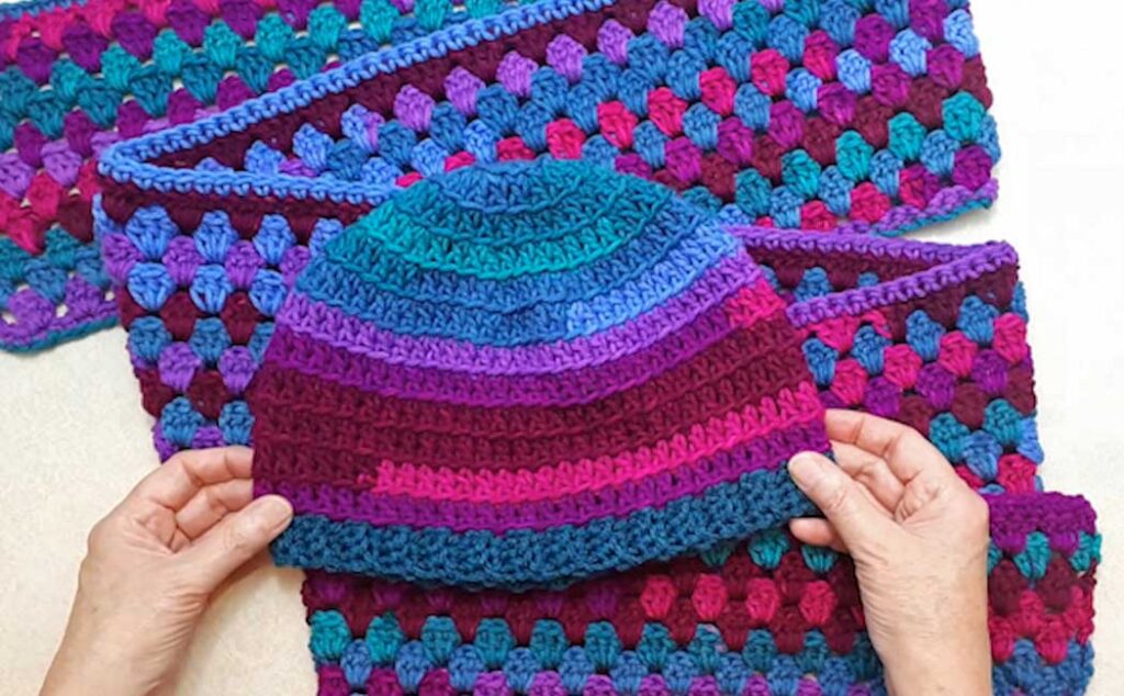 Blue top granny square blanket and matching hat