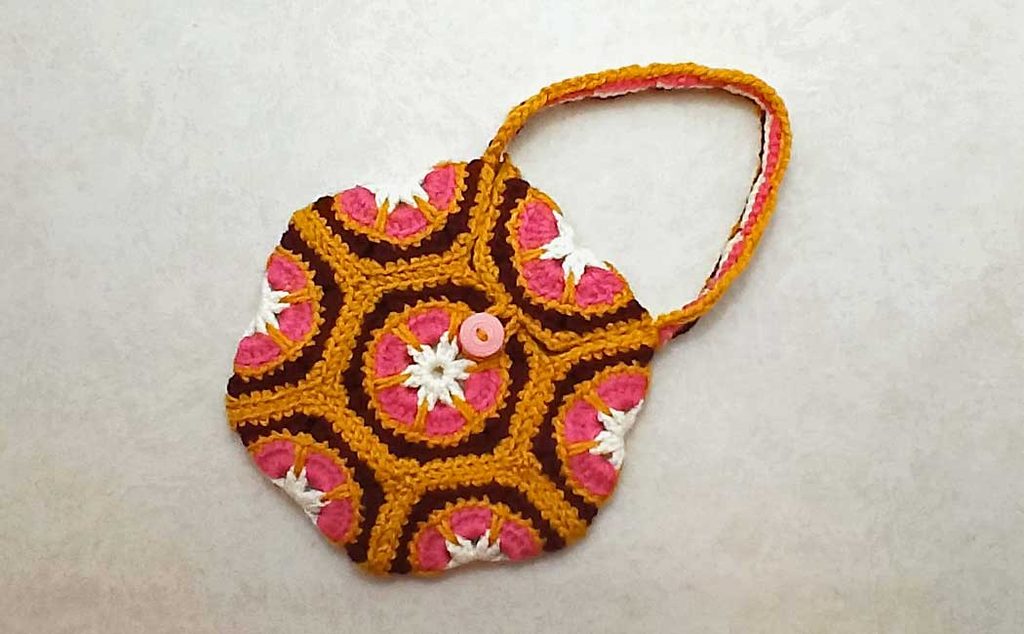 small hexagon purse with a closure