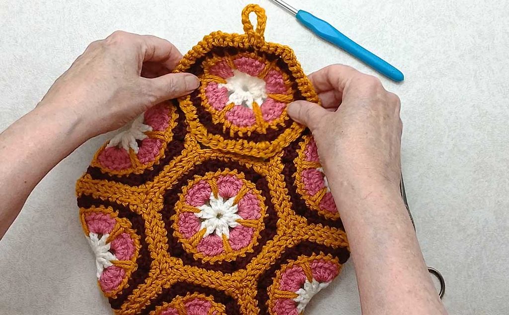 small hexagon purse with a closure flap